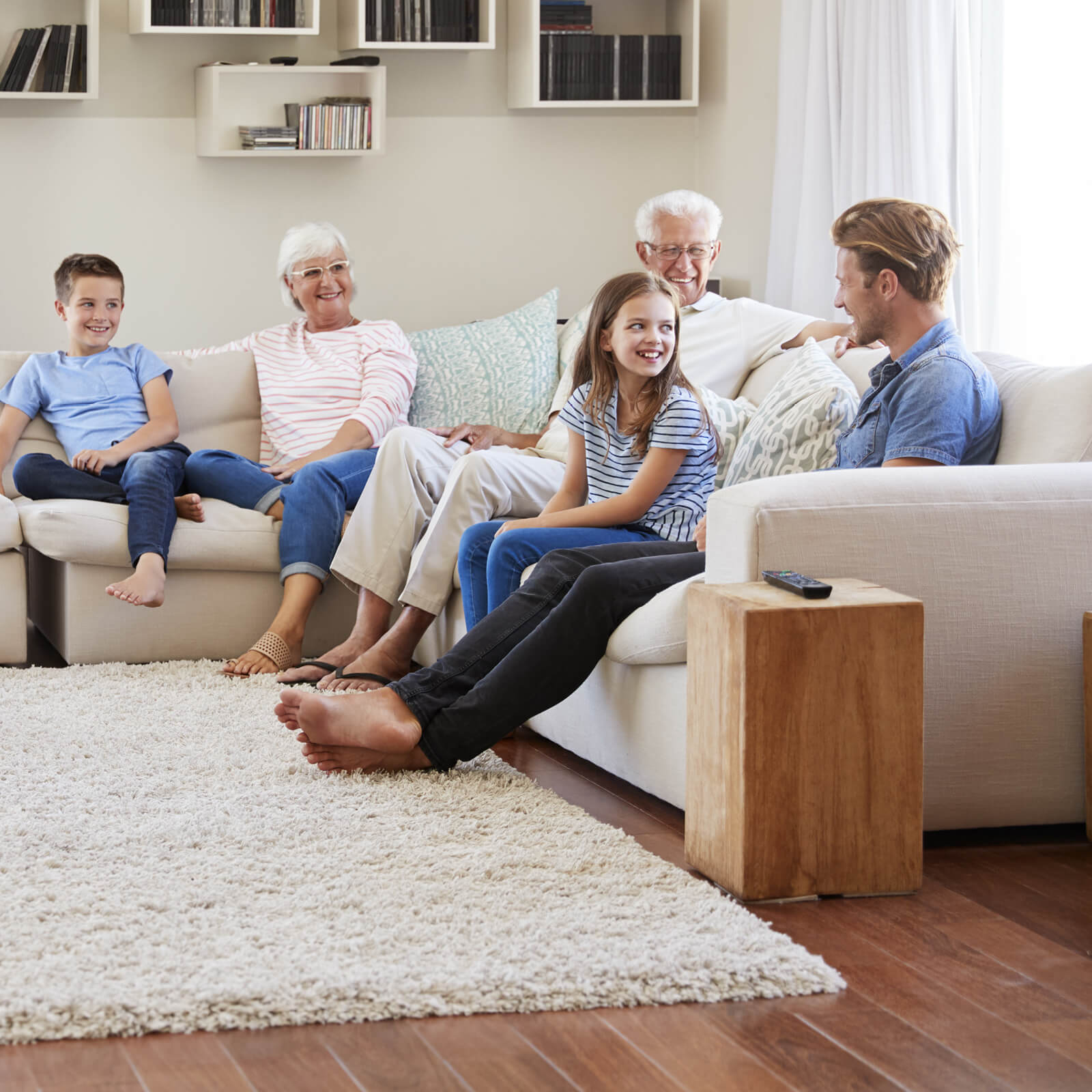 Family enjoying in living room | Carpet Town